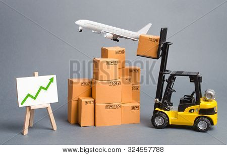 Cargo Airplane, Forklift Truck With Cardboard Boxes And Green Arrow Up. Increase Freight Transportat