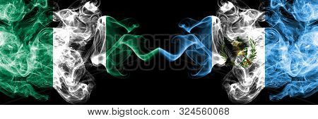 Nigeria Vs Guatemala, Guatemalan Abstract Smoky Mystic Flags Placed Side By Side. Thick Colored Silk