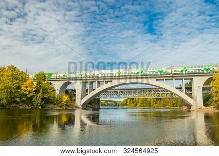 Kouvola, Finland - 25 September, 2019: Autumn Landscape Of Bridge With Moving Passenger Train And Ky