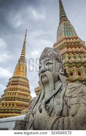 Chinese Guard Statue In Wat Pho Buddhist Temple, Bangkok, Thailand