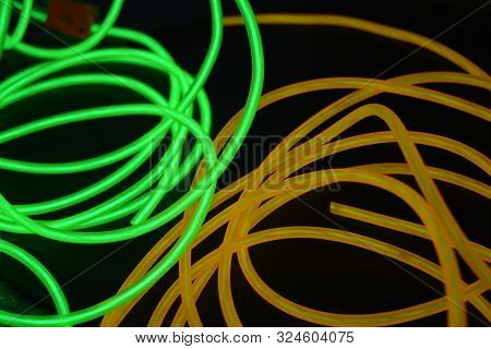 Bright Luminous Yellow And Green, Lime Neon Wires In Different Formats And Layouts. An Electrolumine