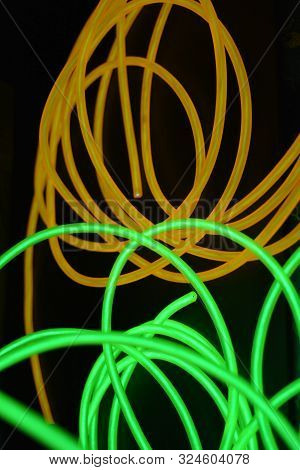Bright Luminous Yellow And Green, Lime Neon Wires In Different Formats And Layouts. An Electrolumine