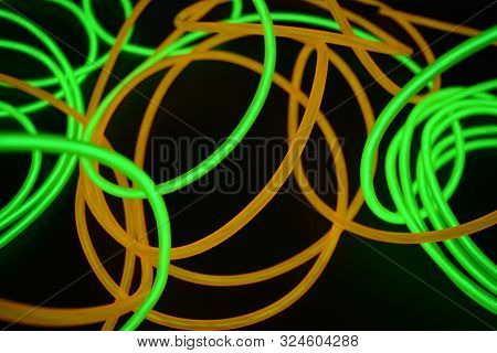 Bright Luminous Yellow And Green, Lime Neon Wires In Different Formats And Layouts. An Electrolumine