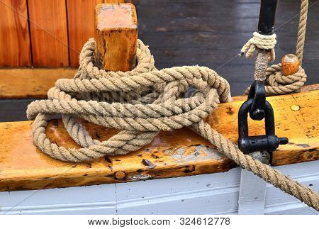 Detailed Close Up Detail Of Ropes And Cordage In The Rigging Of An Old Wooden Vintage Sailboat