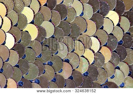 Shiny Gold Glitter Sequins Fabric Closeup Photo. Glamorous Party Style Fabric. Golden Glitter Textur