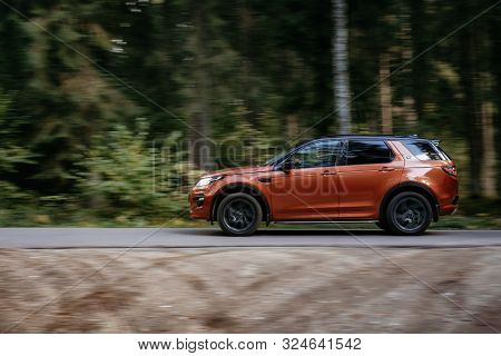 Minsk, Belarus - September 24, 2019: Borwn Color Car Land Rover Discovery Sport Fast Moving On Count
