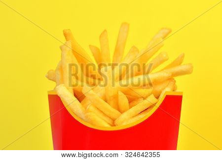 Frybox With French Fries On A Yellow Background, Close-up