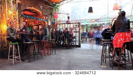 Budapest, Hungary - April 2019: Interior View Of The Famous Szimpla Garden Ruin Pub With People Sitt