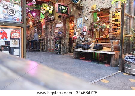 Budapest, Hungary - April 2019: Interior View Of The Famous Szimpla Garden Ruin Pub With Woman Sitti