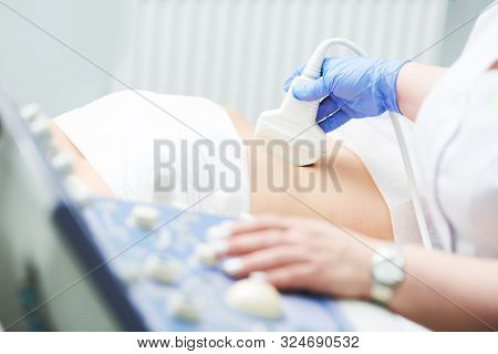 ultrasound scan. Examining stomach of female patient