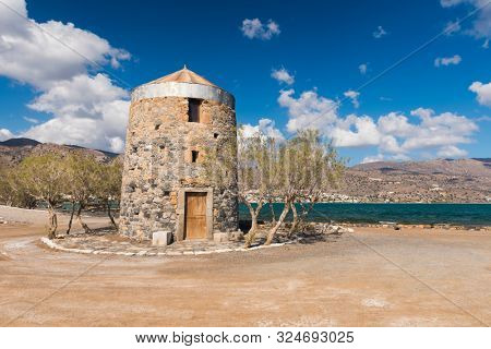 Old Windmills Poros Elounda at Spinalonga Peninsula near the town of Elounda, Island of Crete - Greece