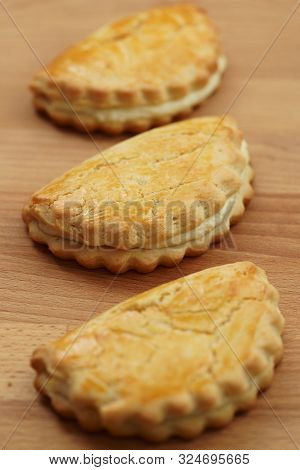 Freshly Baked Sochni. Wooden Background, High Resolution