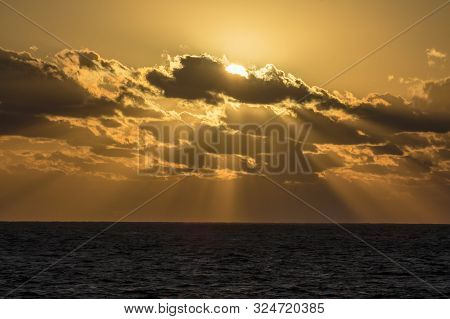 Sun Sends Sunbeams To The Caribbean Sea.