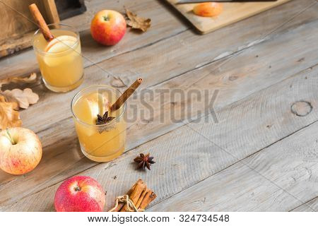 Spicy Apple Cider Drink. Seasonal Autumnal Homemade Apple Cider On Wooden Table, Copy Space.