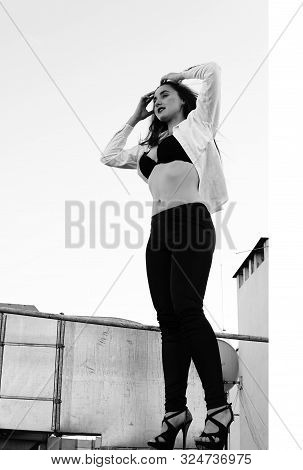 Young Sexy Woman Posing In The Roof, Wearing Leater Jacket, Swag Floral Hat Mirrored Sunglasses And 