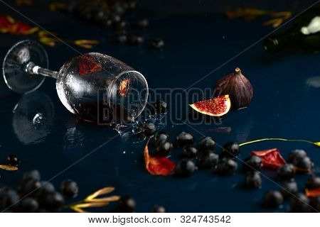 Autumn Wine With Grape On Blue Handmade Table.