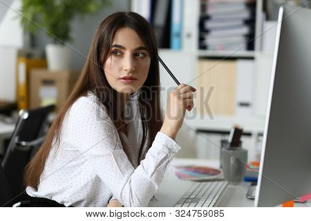 Portrait Of Thoughtfully Model Imagining New Art Project. Wonderful Businesslady Working At Architec