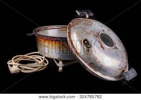 Old Aluminum Electric Cookware. Kitchen Accessories Used In Central Europe.