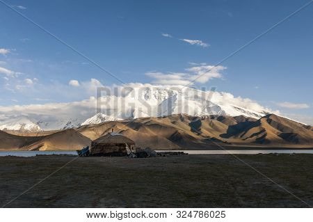 Traditional Yurt At The Shore Of The Karakul Lake, In The Xinjiang Province, China