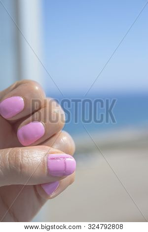 Semipermanent Pink Gel Painted Nails. One Hand