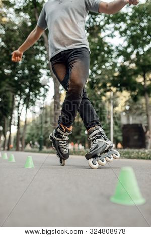 Roller skating, skater rolling around the cones