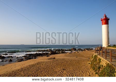 The Umhlanga Lighthouse And Beach With Promenade