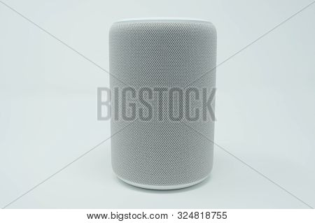 Gray Smart Speaker With Cloth Texture.