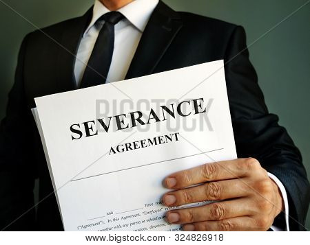 Manager Is Holding Severance Agreement Papers For Signing.