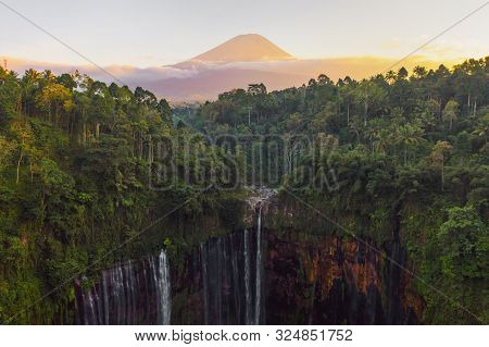 Aerial View Of Tumpak Sewu Waterfall And Semeru Mountain At Sunrise Located In East Java, Lumajang,