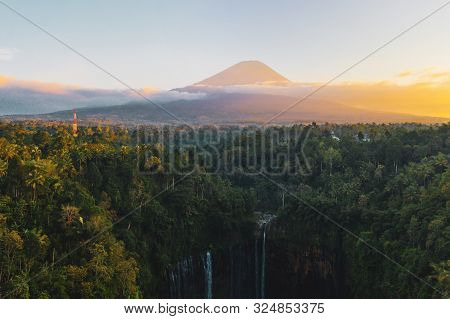 Aerial View Of Tumpak Sewu Waterfall And Semeru Mountain At Sunrise Located In East Java, Lumajang,