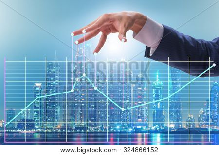 Businessman controlling the market with strings