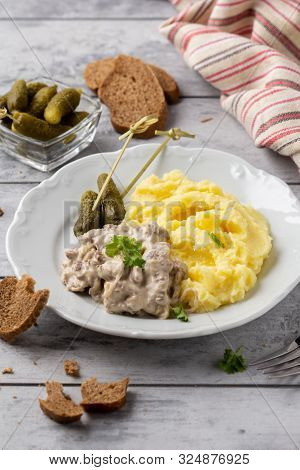 Beef Stroganoff, Traditional Russian Dish Of Goulash With Beef In Creamy Sauce, Mashed Potatoes And