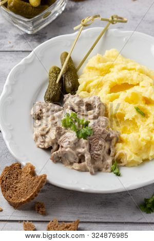 Beef Stroganoff, Traditional Russian Dish Of Goulash With Beef In Creamy Sauce, Mashed Potatoes And