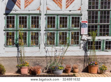 Lauenburg, Germany - April 16, 2019: Flowers In Pots At A Historic House In Lauenburg, Germany
