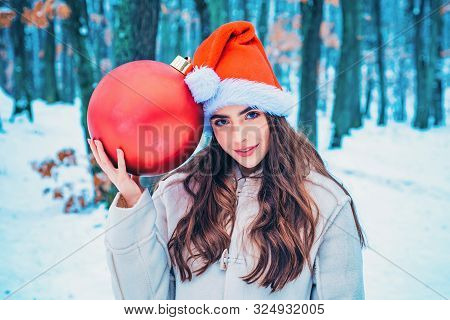 Winter Woman Happy. Winter Portrait Of Young Woman In The Winter Snowy Scenery. What Happens During 