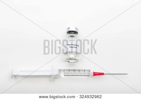 Medical Concept Showing Medical A Medical Vial Reading Pneumococcal Vaccine And A Syringe