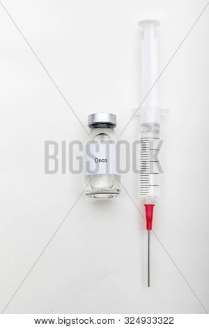 Medical Concept Showing Medical A Medical Vial Reading Deca And A Syringe