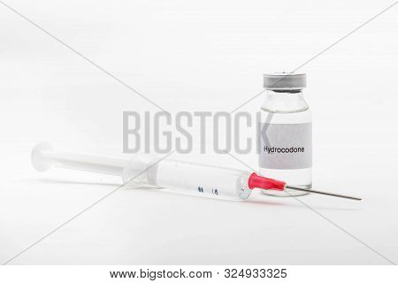 Medical Concept Showing Medical A Medical Vial Reading Hydrocodone And A Syringe