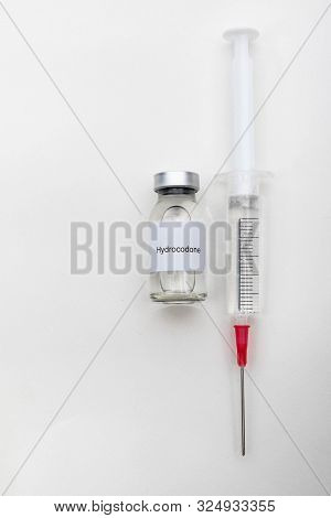 Medical Concept Showing Medical A Medical Vial Reading Hydrocodone And A Syringe