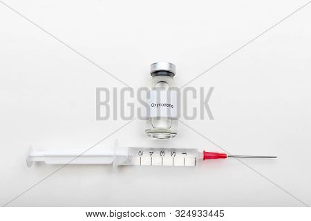 Medical Concept Showing Medical A Medical Vial Reading Oxycodone And A Syringe