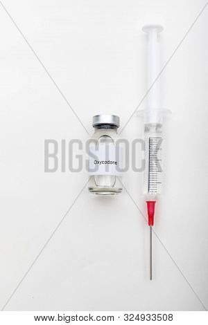 Medical Concept Showing Medical A Medical Vial Reading Oxycodone And A Syringe