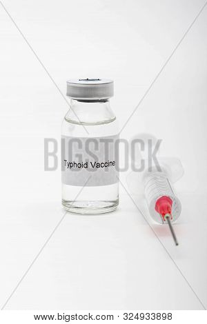 Medical Concept Showing Medical A Medical Vial Reading Typhoid Vaccine And A Syringe