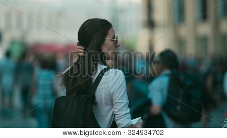 Girl On The Street Among The Crowd Of Passers-by, Photos In The Style Of Surveillance. Young Woman I