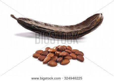 Carobs Pod With Beans Isolated On White Background
