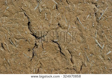 Old Wall Of A Combination Of Red Clay And Straw