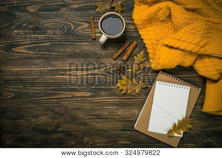 Autumn Flat Lay Background With Coffee, Notebook, Knitwear And Yellow Leaves. Creative Workplace Lay