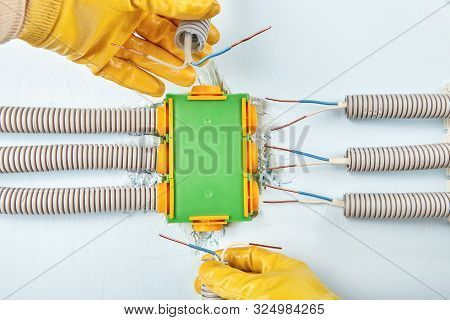 Residential Electrical Services, Electrician Install Electrical Wire To Junction Box. Rectangular El