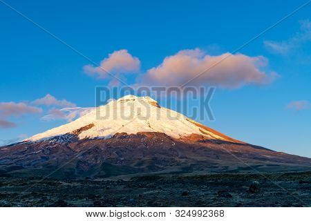 The Majestic Cotopaxi Volcano With The Santo Domingo Lagoon.