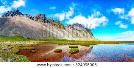 Splendid Sunny Day And Gorgeous Meadow Near Vestrahorn Mountaine On Stokksnes Cape In Iceland. Locat