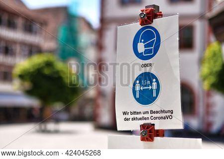 Mosbach, Germany - June 2021: Signs For Face Mask And Distance Requirement In German City With Text 